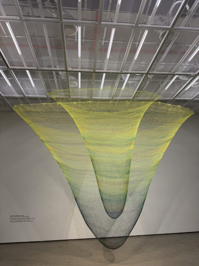 Large hanging net installation artwork at MMCA Seoul"