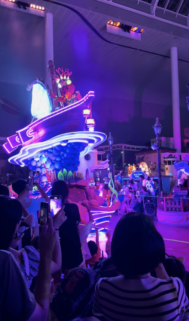 Glowing ship-shaped float at the Lotte World evening parade in Seoul