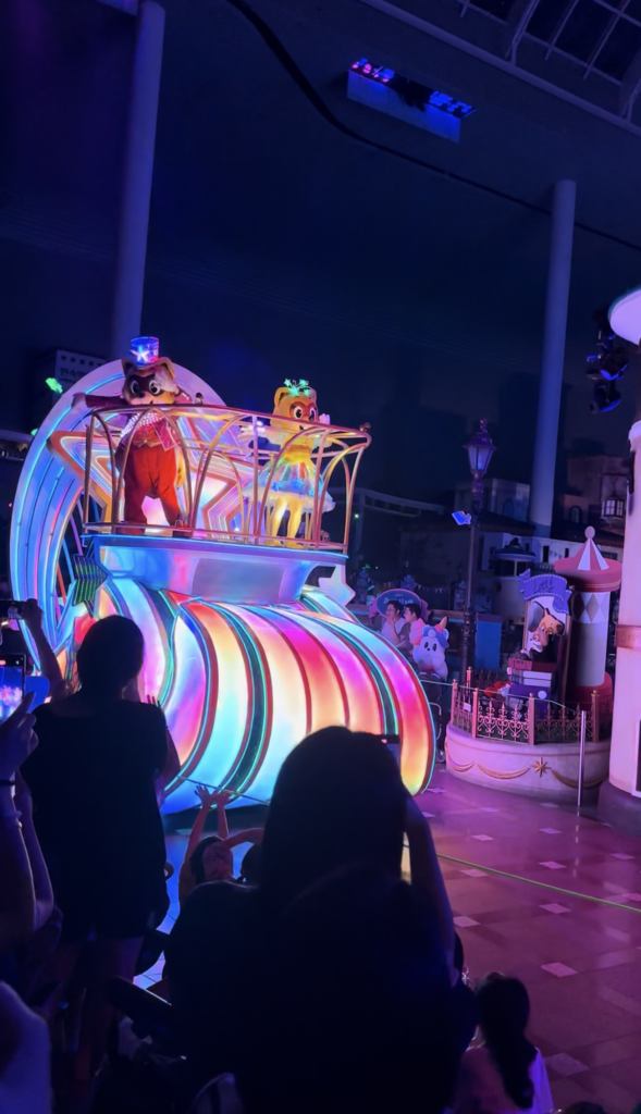 Colorful rainbow parade float with Lotte World characters in Seoul
