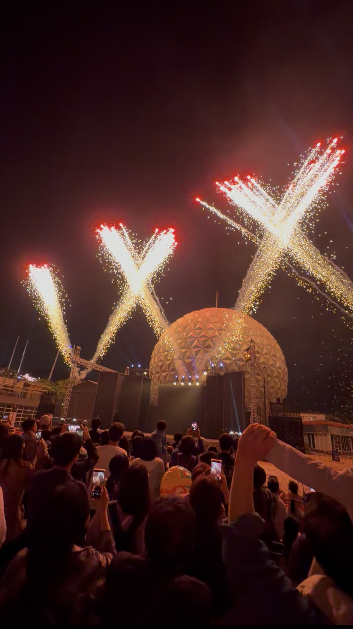 Family watching the evening fireworks and light show at Seoul Land