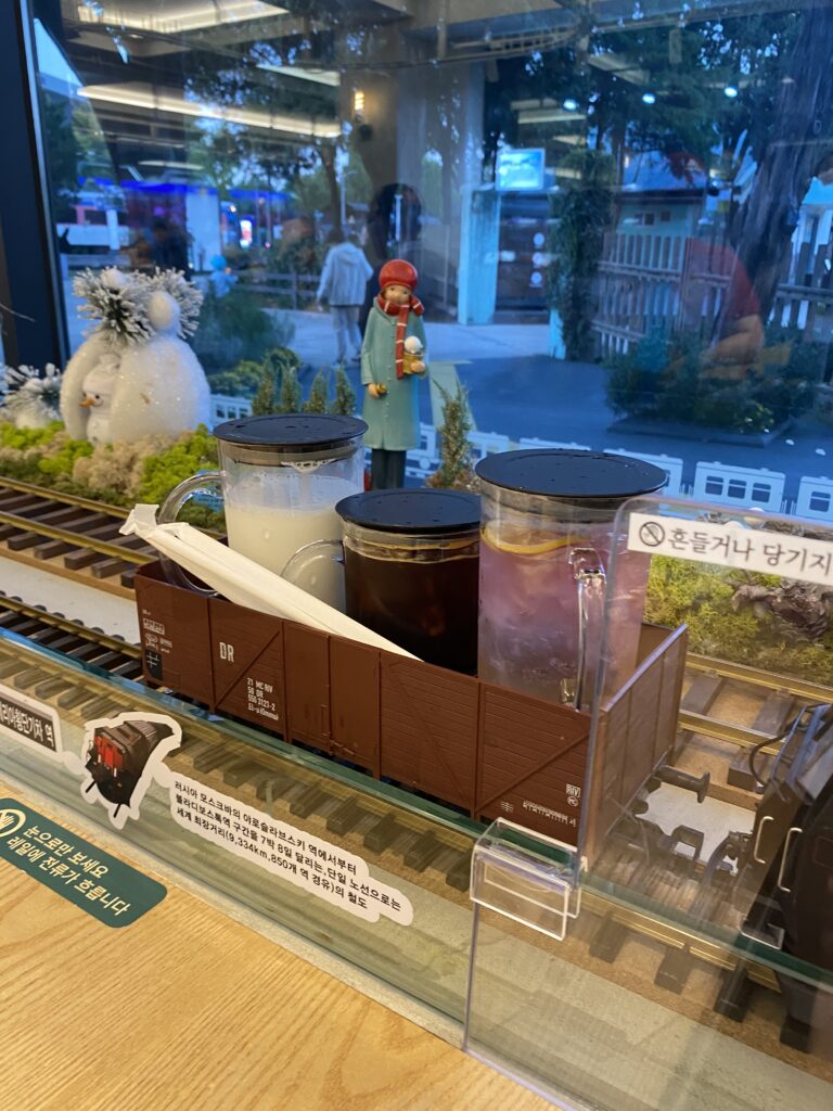 Drinks served in a model train freight car at the train-themed café inside Hwarangdae Railroad Park