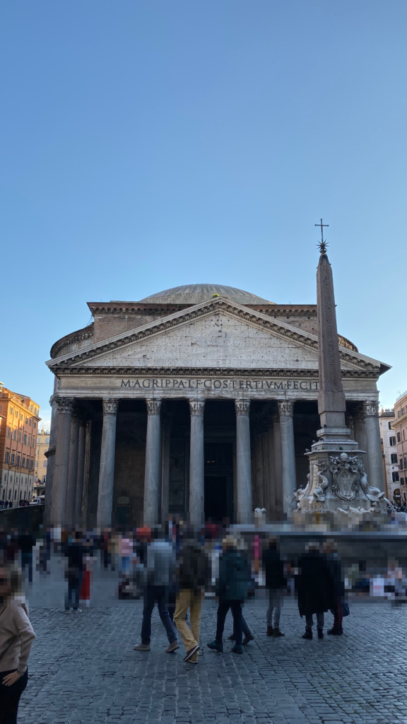 Front facade of the Pantheon in Rome with the obelisk fountain in the daytime