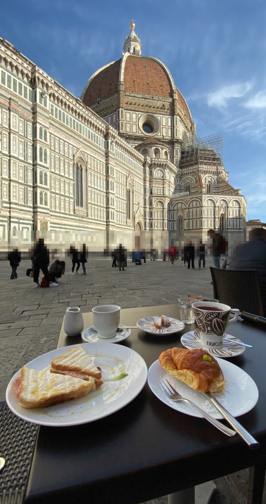 Breakfast at an outdoor cafe in the piazza facing the Florence Duomo