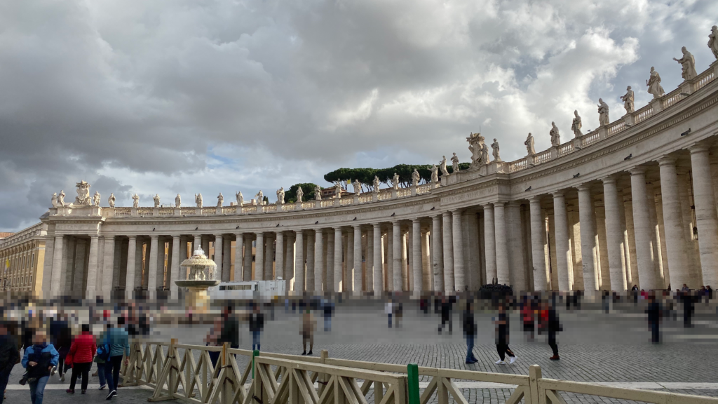 Bernini's colonnade at St. Peter's Square in Vatican City under a cloudy sky