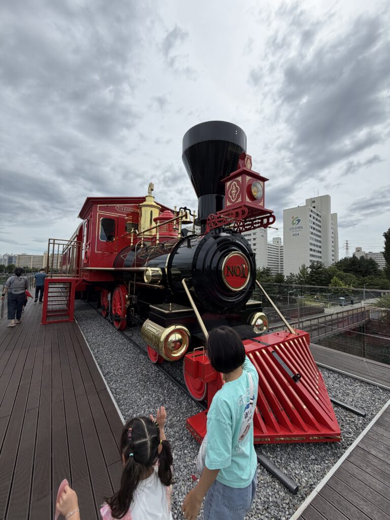 Red 'NO.1' vintage steam locomotive on display at the Gyeongchun Maru café, Gyeongchun Line Forest Trail, Nowon, Seoul