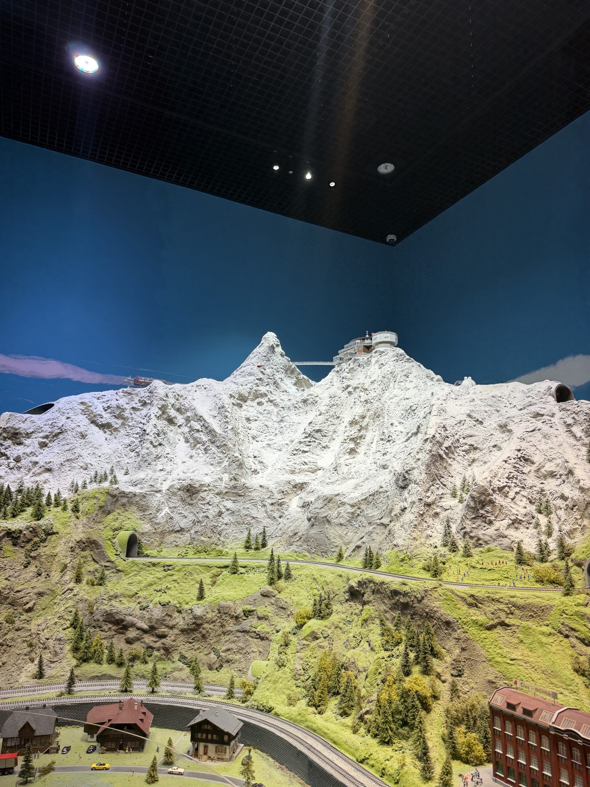 Miniature Swiss Alps diorama with a snow-capped summit station and mountain railway at the Swiss Pavilion