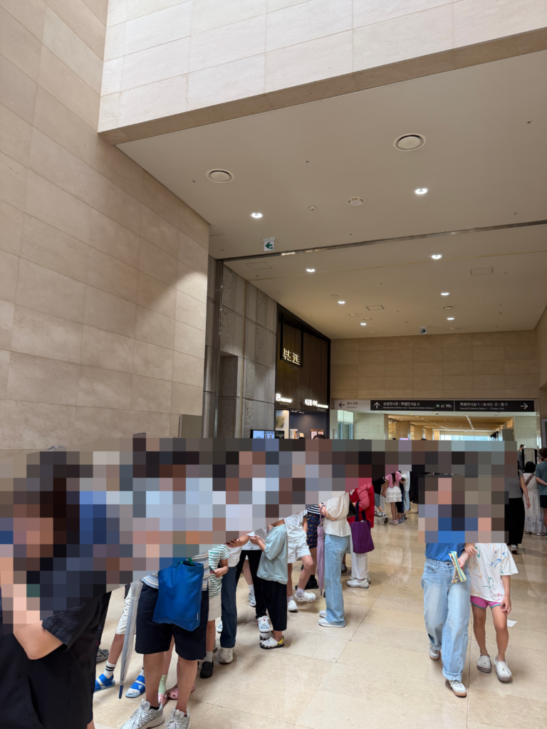 Long lunchtime queue inside the National Museum of Korea near the food court, Seoul.