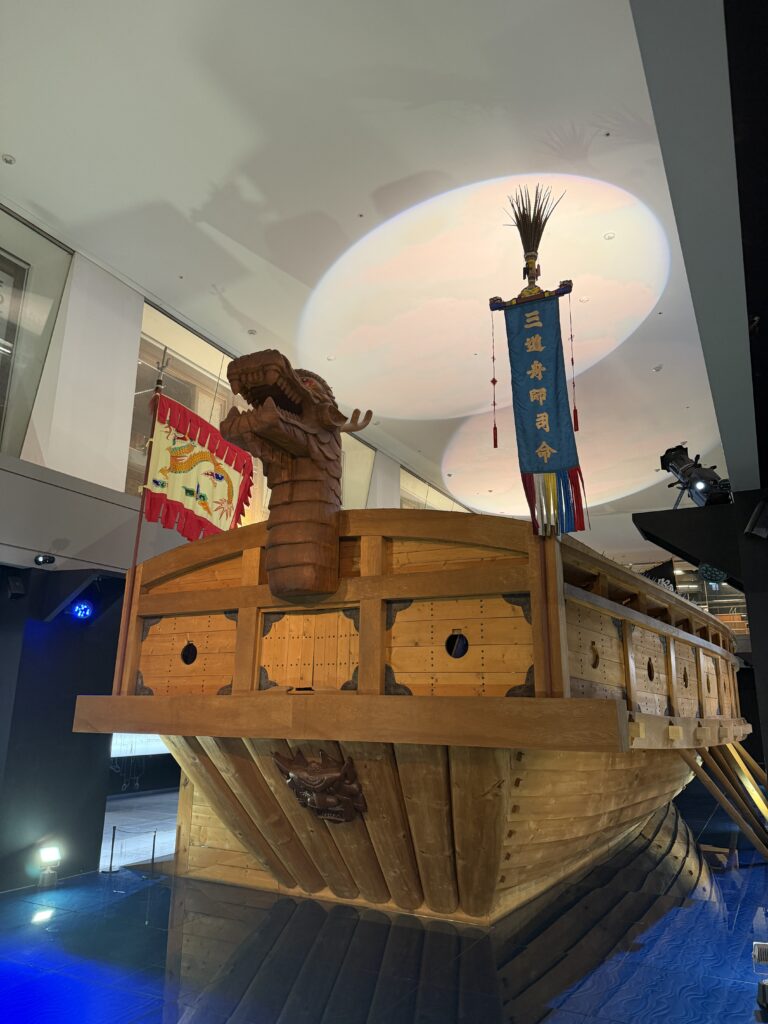 Full-scale replica panokseon warship bow with carved dragon head inside The Story of Admiral Yi Sunshin, Gwanghwamun